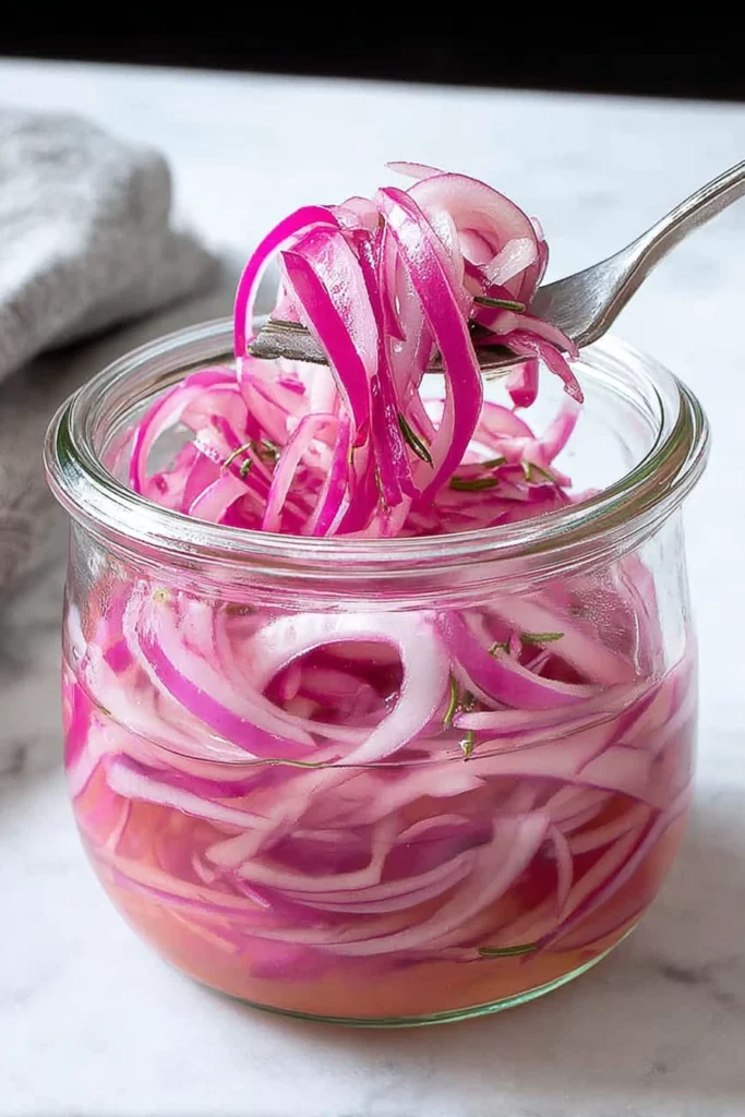pickled red onions, easy recipe, quick preparation, tangy flavor, vibrant color, homemade condiment